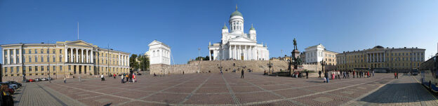 A panoramic photo of the Senate Square in Helsinki, Finland. From left: the main building of University of Helsinki, Helsinki Cathedral and the Government Palace. The statue of Alexander II is at the center.